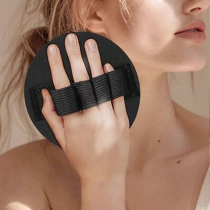 Hand holding the round exfoliating glove